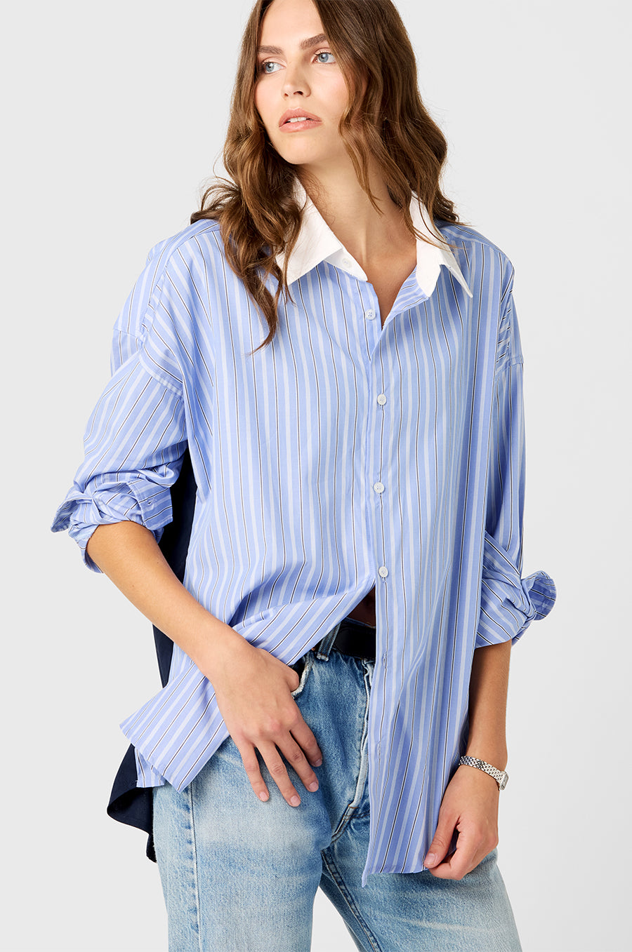 Model wearing the lady & the sailor Colorblocked Sunday Shirt in Navy/Blue Stripe.