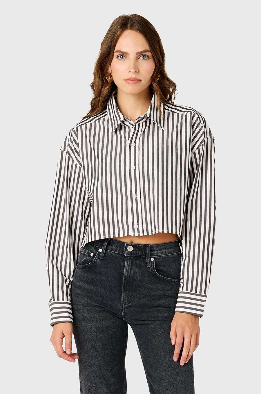 Model wearing the lady & the sailor Cropped Boxy Button up in Black Ivory Stripe.