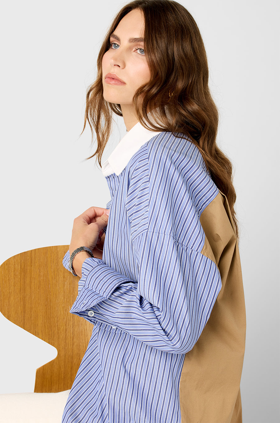 Model wearing the lady & the sailor Colorblocked Sunday Shirt in Khaki/Blue Stripe.