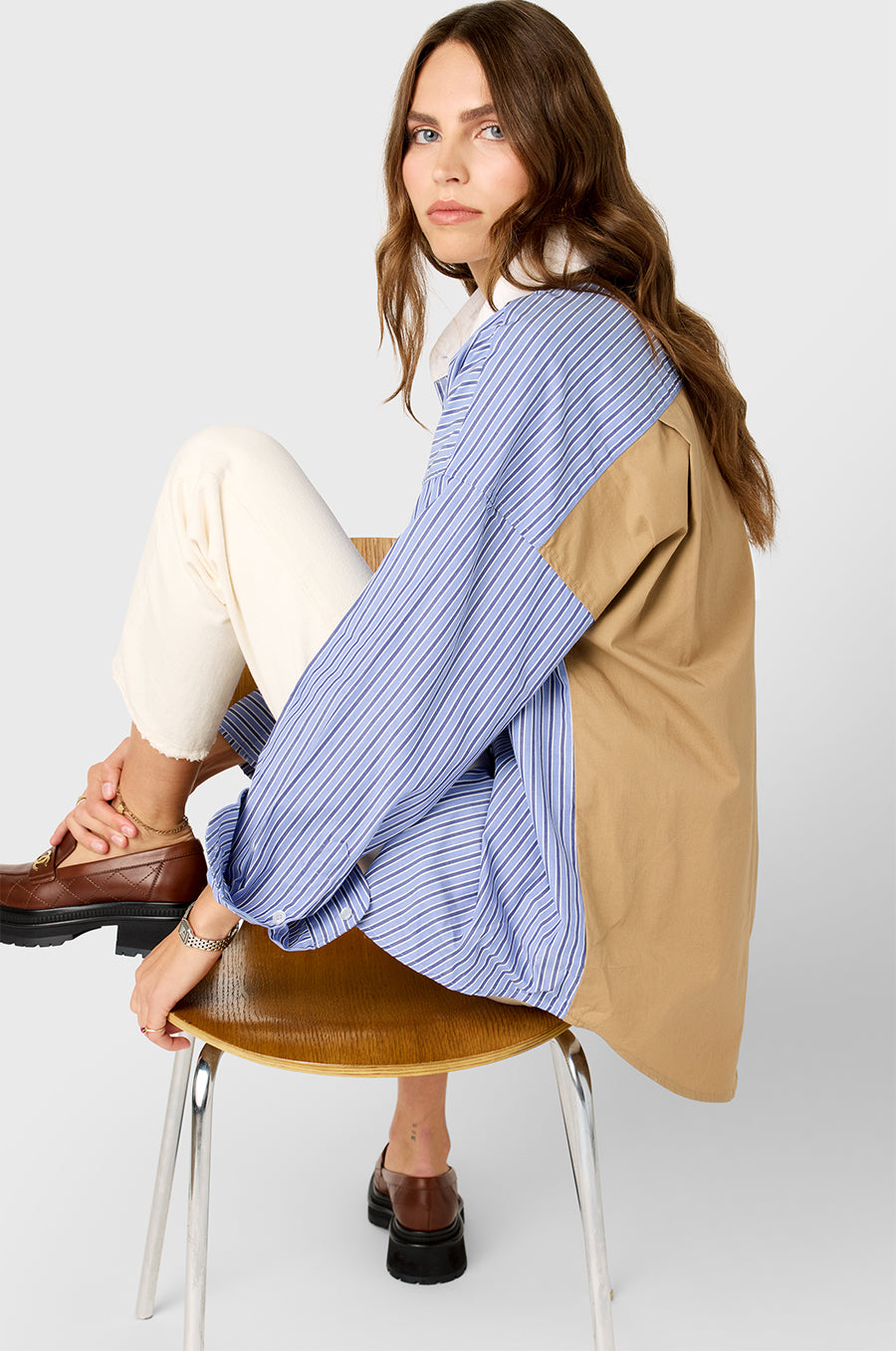 Model wearing the lady & the sailor Colorblocked Sunday Shirt in Khaki/Blue Stripe.