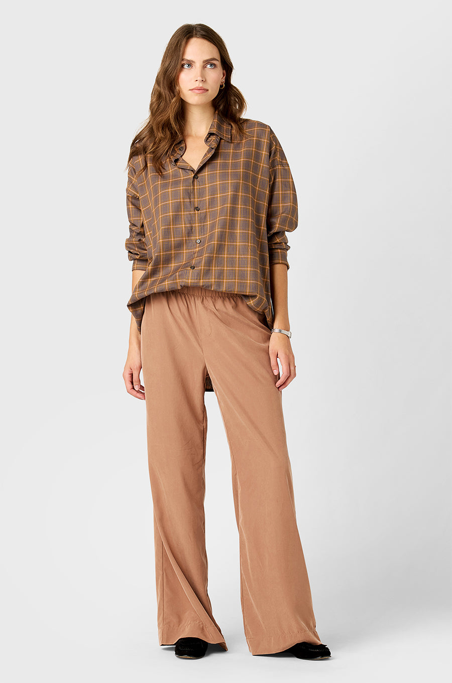 Model wearing The Lady & The Sailor Sunday Shirt in Dusk Plaid and Silky Wide Leg Pant in Washed Rosegold.