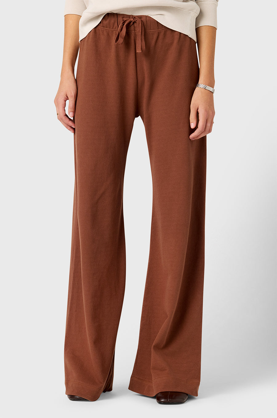 Model wearing The Lady & The Sailor Wide Leg Pant in Chestnut - a brown mid-rise wide leg sweatpant.