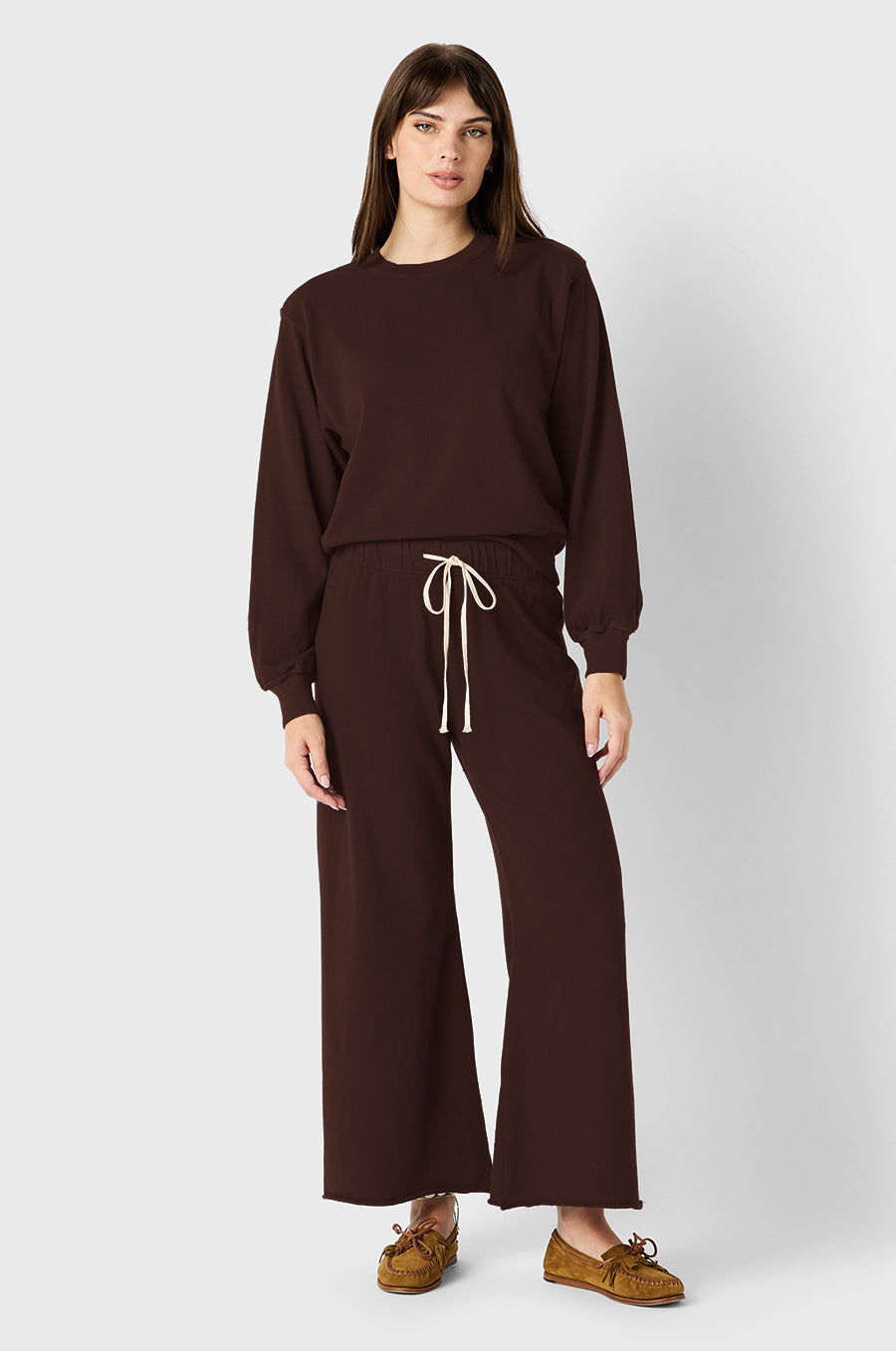 Brunette Model wearing the lady & the sailor French Flare Pant in Chocolate Organic Cotton.