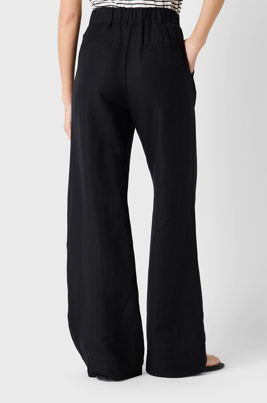 Brunette Model wearing the lady & the sailor Slouchy High Waisted Trouser in Black