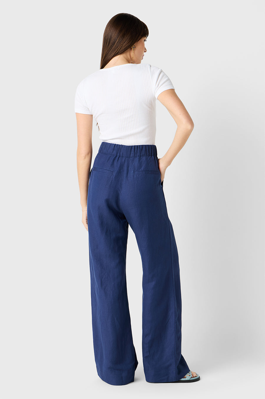 Brunette Model wearing the lady & the sailor Slouchy High Waisted Trouser in Nautical Navy