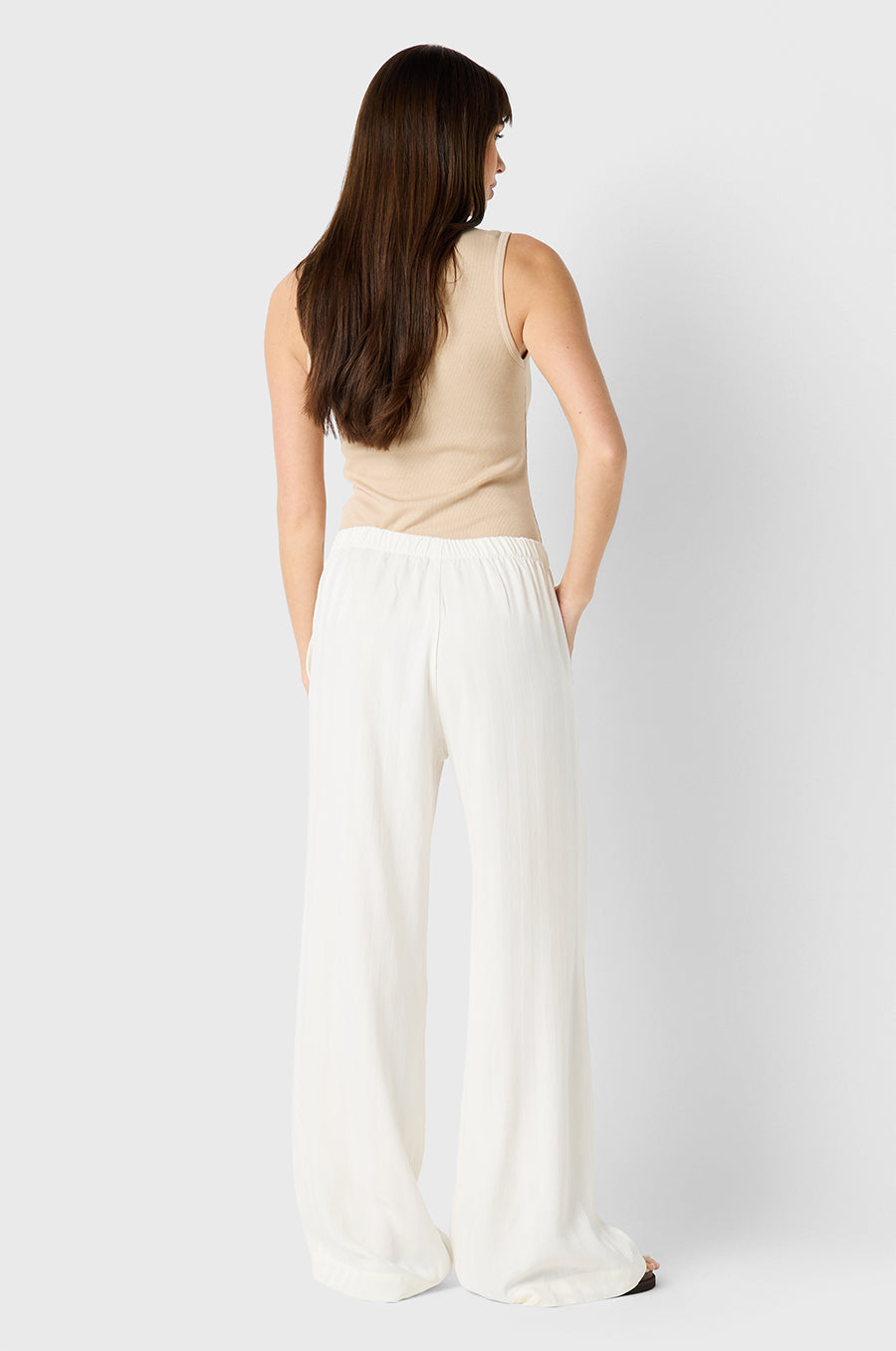 Brunette model wearing the lady & the sailor Wide Leg Pant in Ivory Sateen Stripe