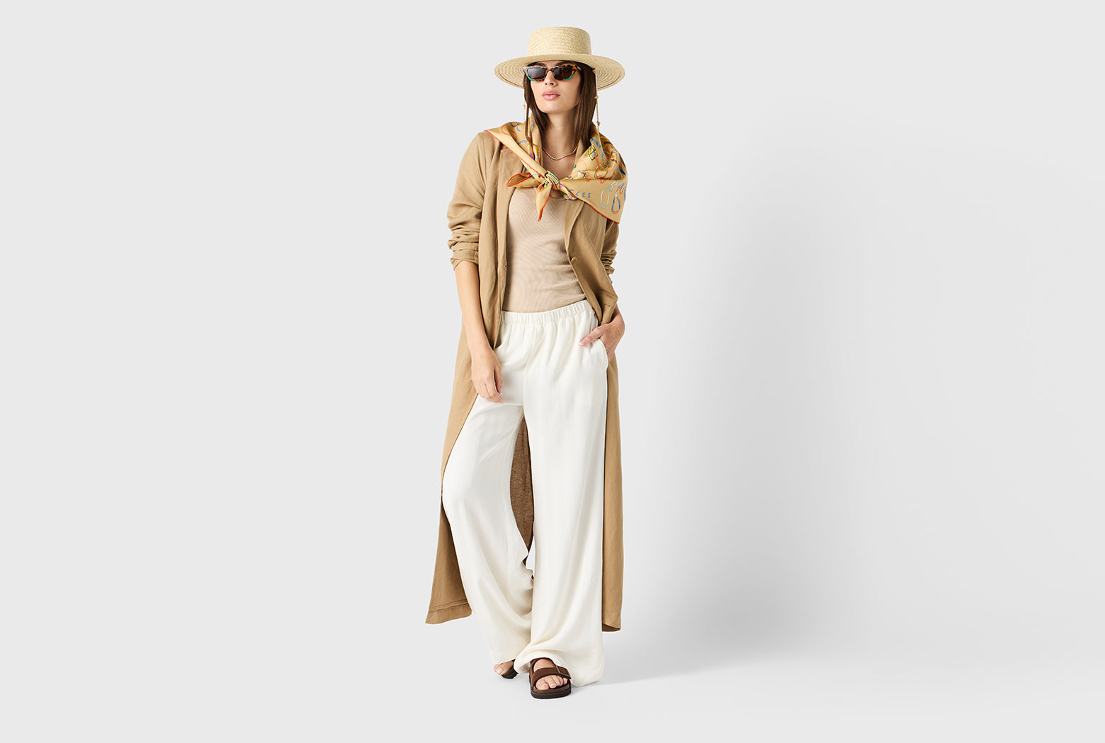 Brunette model wearing the lady & the sailor Wide Leg Pant in Ivory Sateen Stripe