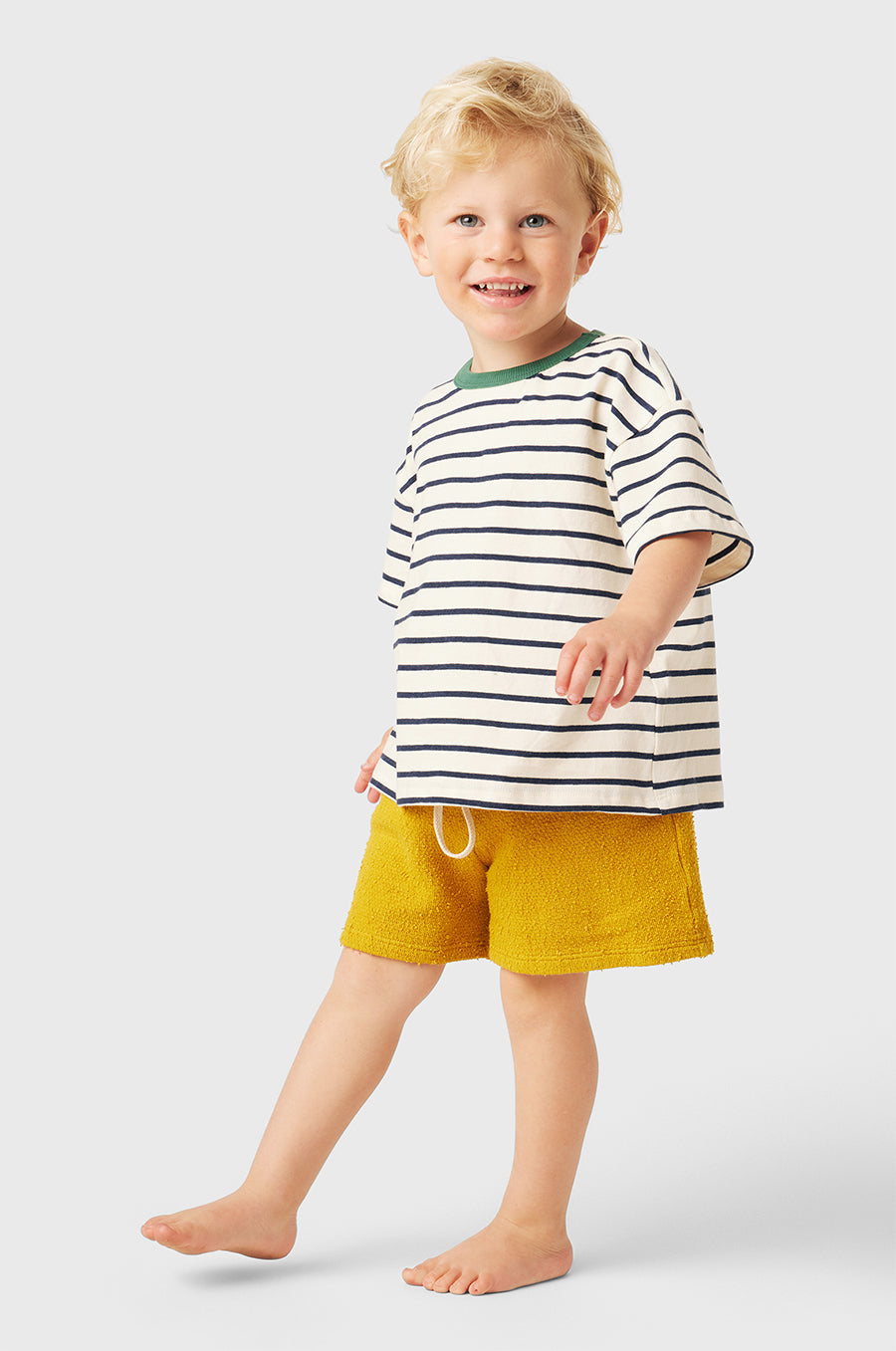 Model wearing Kids Weekend Short in Marigold Bouclé little lady & petit sailor