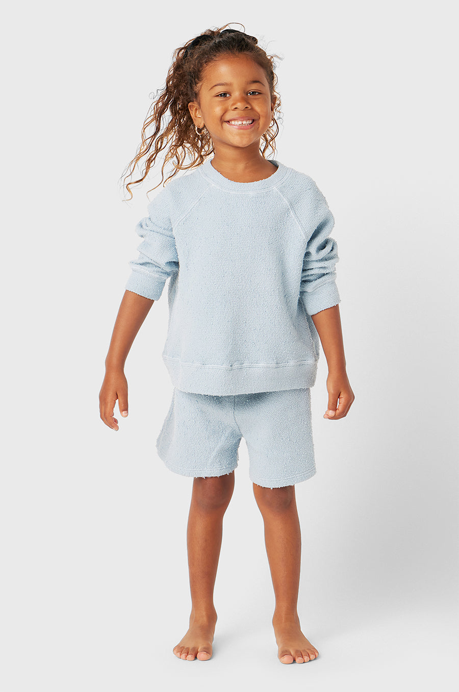 Model wearing Kids Weekend Short in Sky Blue Bouclé little lady & petit sailor