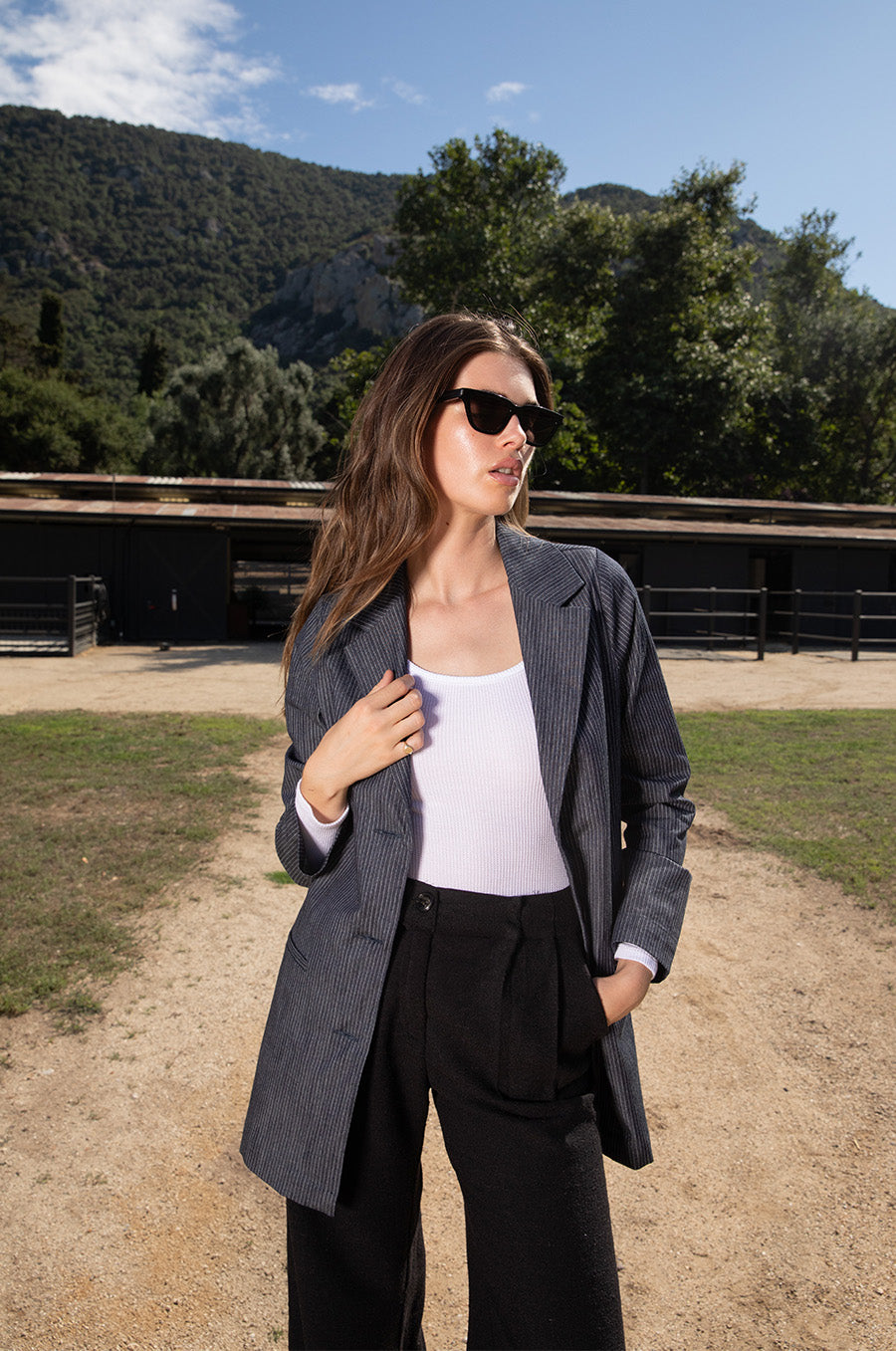 Brunette model wearing the lady & the sailor Long Sleeve Scoopneck Tee in White Thermal.