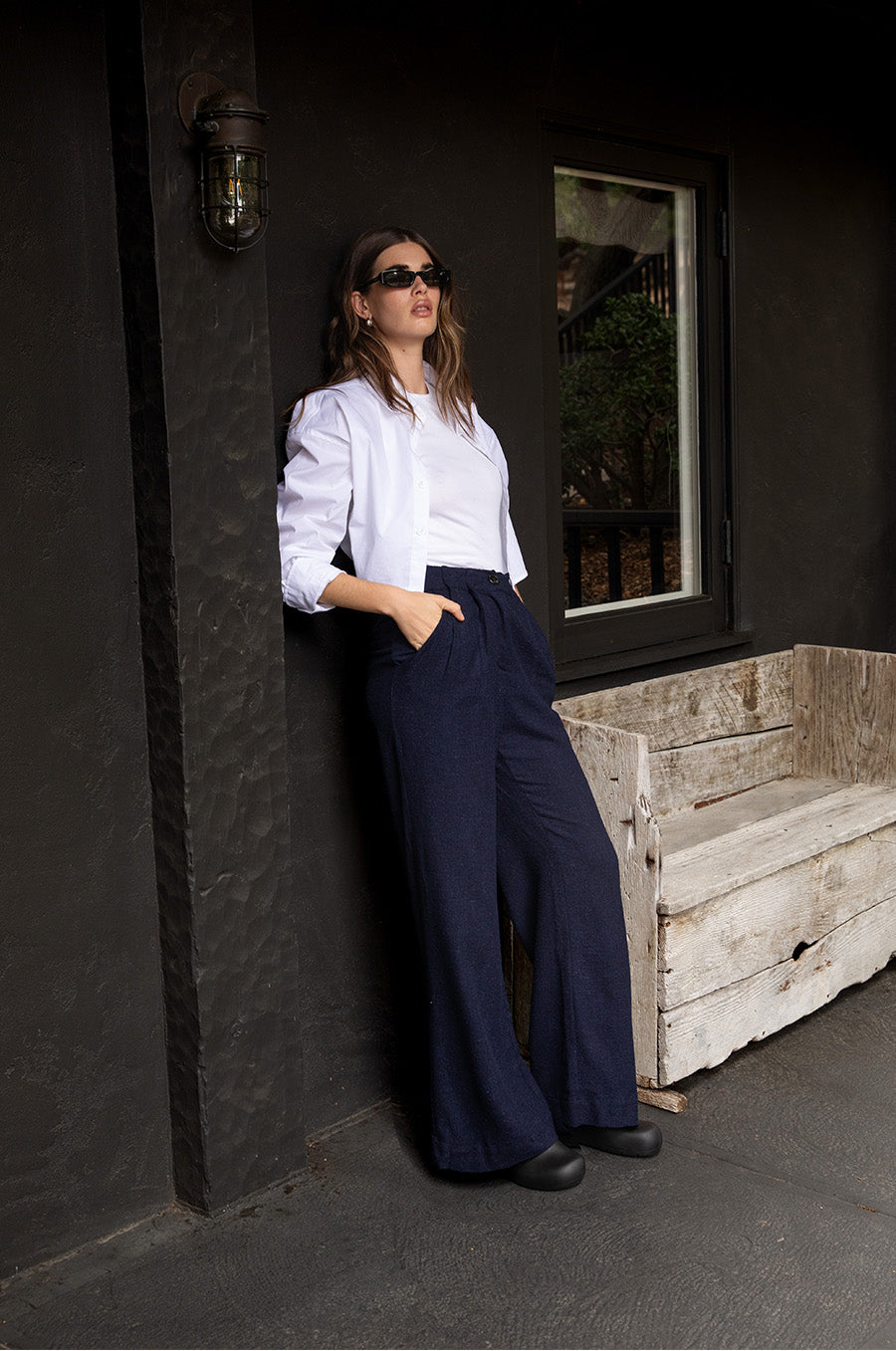 Brunette Model wearing the lady & the sailor Tomboy Tank in White Classic Rib.